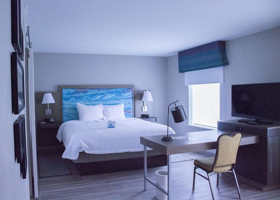 Step into a quiet king retreat with simple, modern style.