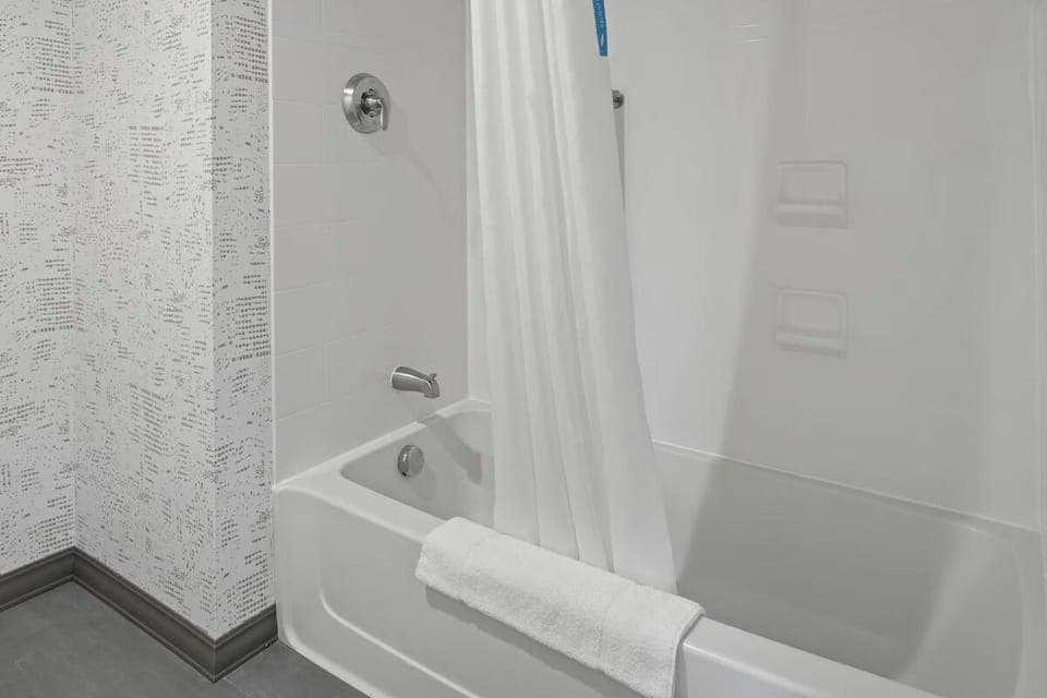Rinse off comfortably in a spotless shower-tub combo.