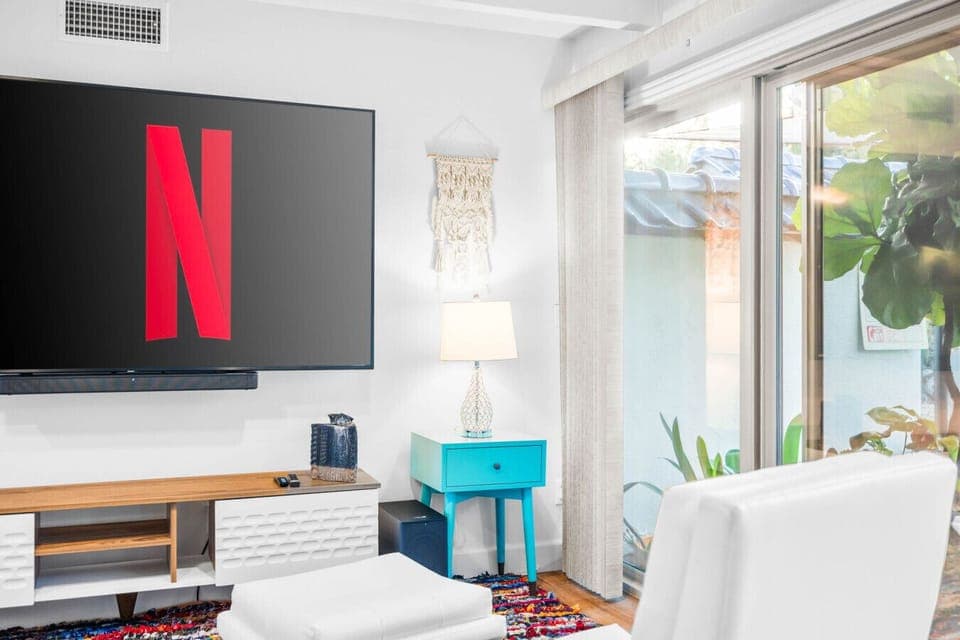 Unwind with your favorite shows on the large smart TV featuring Netflix and surround sound.