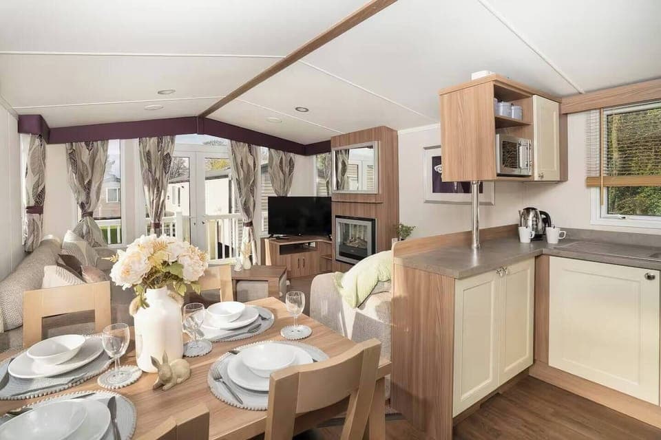 Cozy and stylish caravan with full kitchen, comfy lounge, and bright dining area—perfect for a relaxing getaway!