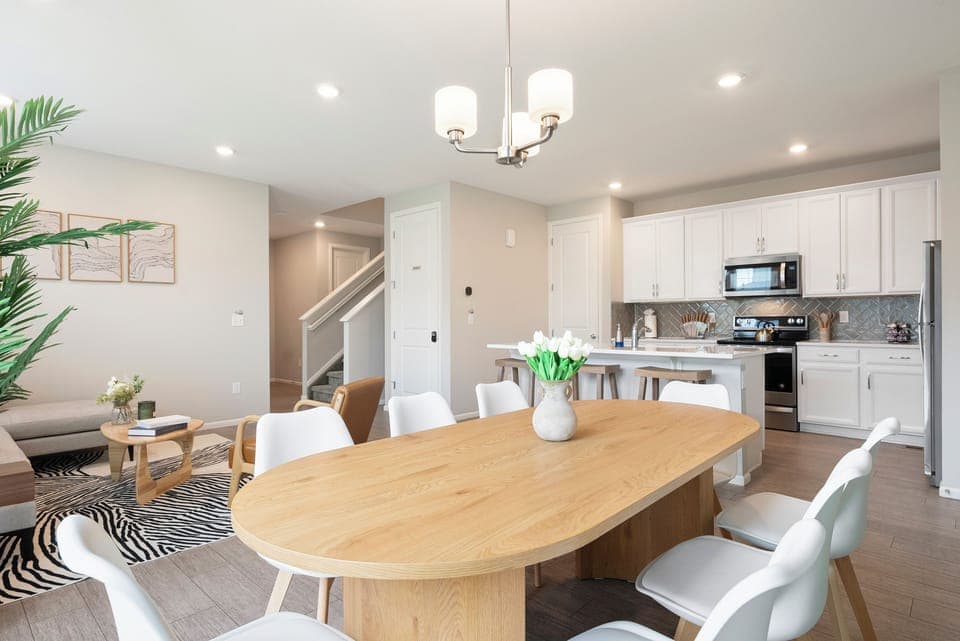 Bright open kitchen and dining with stylish decor, perfect for relaxing.