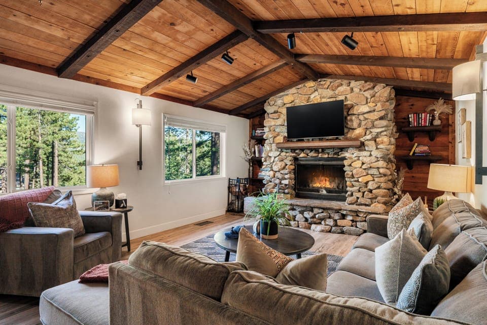 Cozy living area with comfortable seating, a fireplace, and a TV for relaxing nights in.