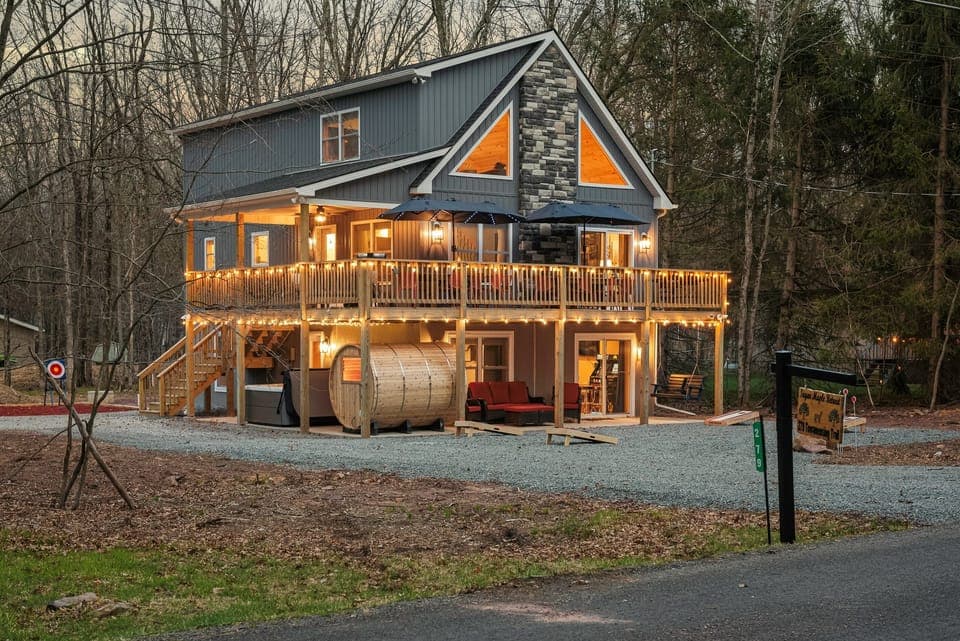 Exterior Escape: Enjoy twinkling lights and nature's embrace on the spacious deck!