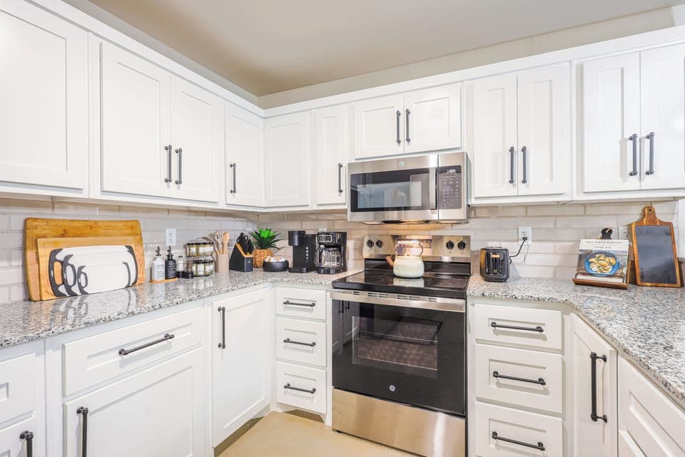 Beautifully designed kitchen with cookware, coffee bar, and more.