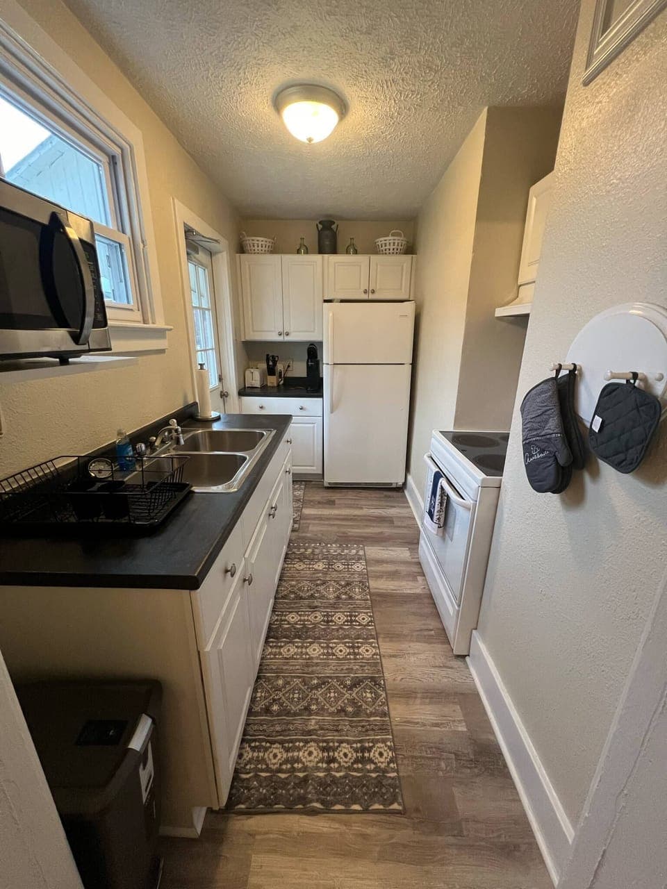 Full kitchen equipped with cooking essentials. 