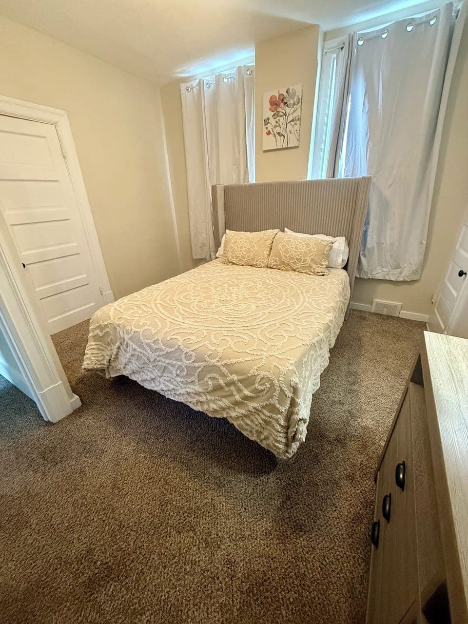 Bedroom #2 with a smart tv and queen size bed.