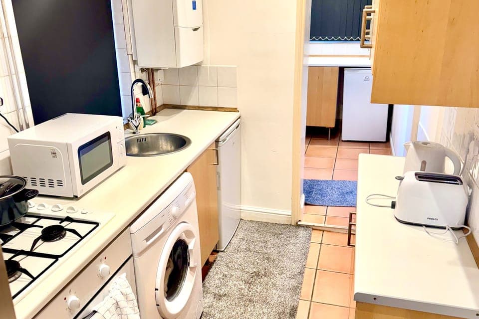 Spacious fully equipped kitchen with provides all basic cooking amenities including cooking condiments 