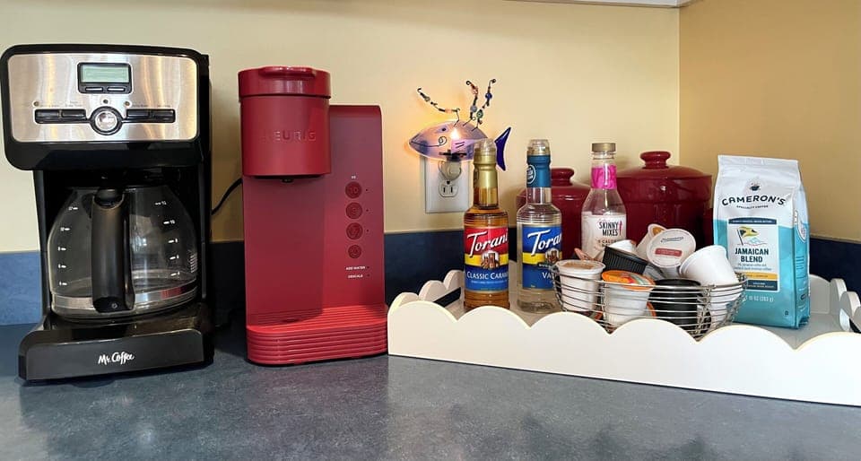 Start your mornings right with our coffee bar—Keurig, drip coffee, syrups, and pods provided for your convenience.