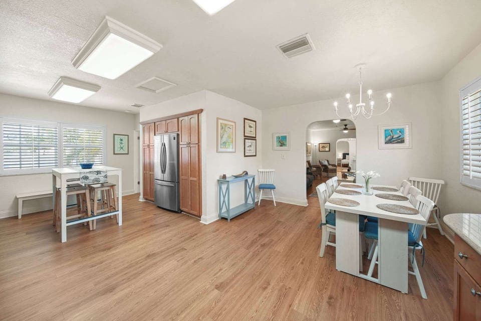 Spacious dining area perfect for family gatherings, featuring modern amenities and charming decor.