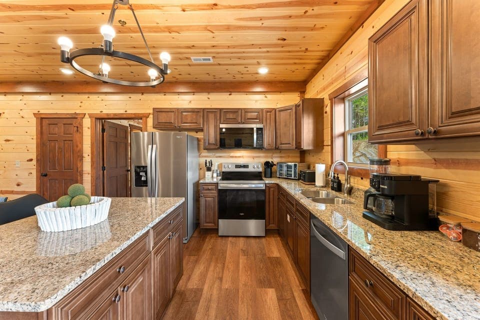 Modern kitchen with stainless steel appliances and all the essentials for home cooked meals.