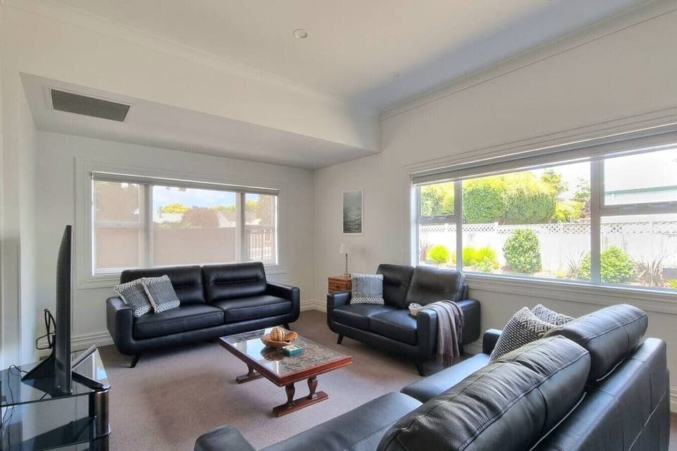 There is plenty of seating in the living space for you to relax and watch TV.