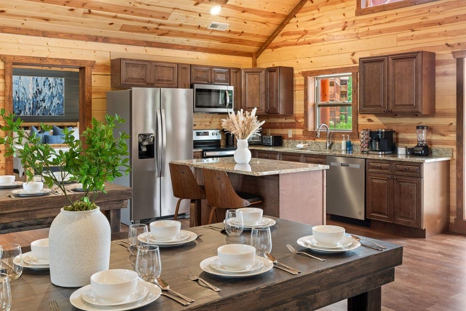 Fully stocked kitchen with granite countertops and everything you need to dine in.