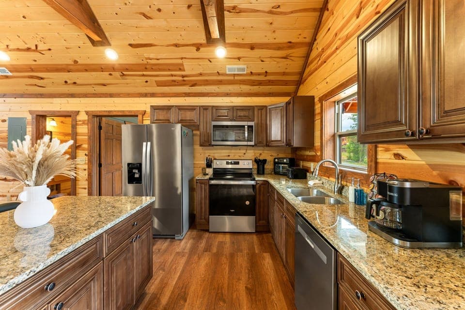 Kitchen with stainless steel appliances and all the essentials for home cooked meals.