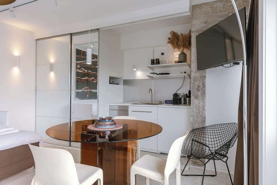 Dining Table Next to Open Kitchen & TV