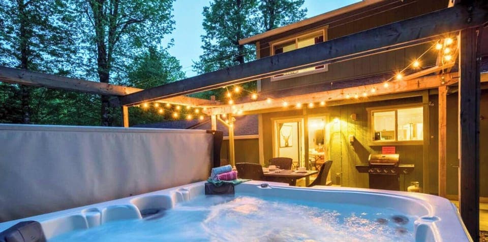 Relax in the hot tub with the night stars at Chateau Relaxeau. Close enough to the outdoor dining so everyone can be involved. 