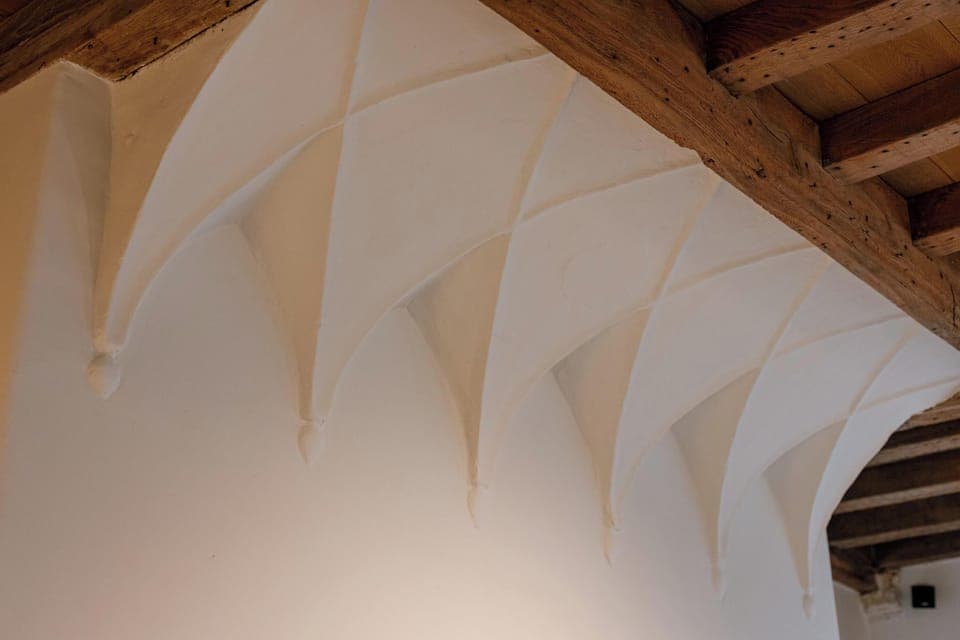 Vaulted ceiling detail celebrating the home’s original architecture.
