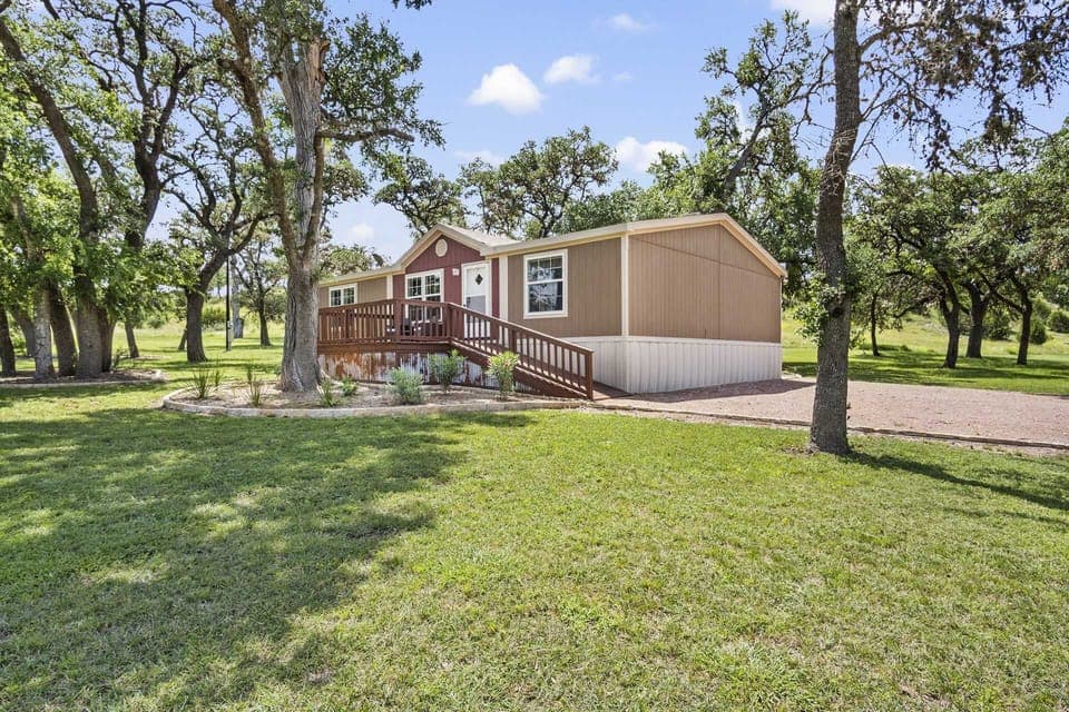 Your cozy escape awaits! Nestled among serene trees, this charming rental offers peace and comfort for your perfect getaway.