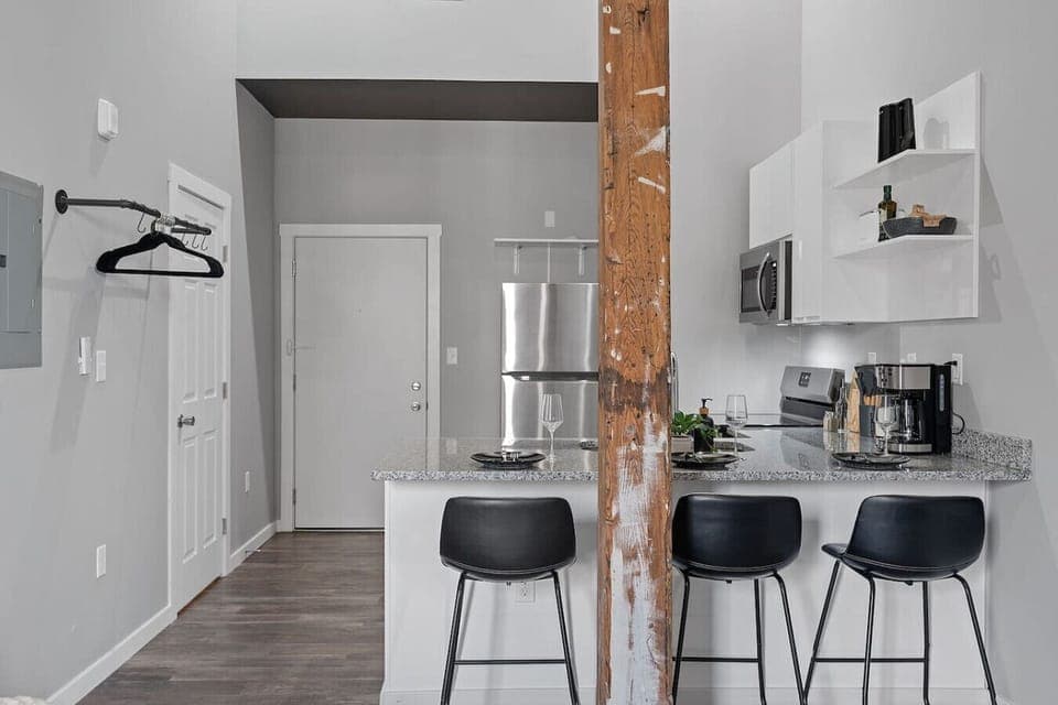 Our kitchen island with three stools