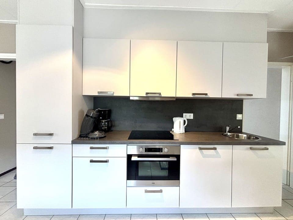 Kitchen Appliance, Kitchen, Cabinetry, Countertop, Major Appliance, Interior Design, Flooring, Wood, Home Appliance, Furniture