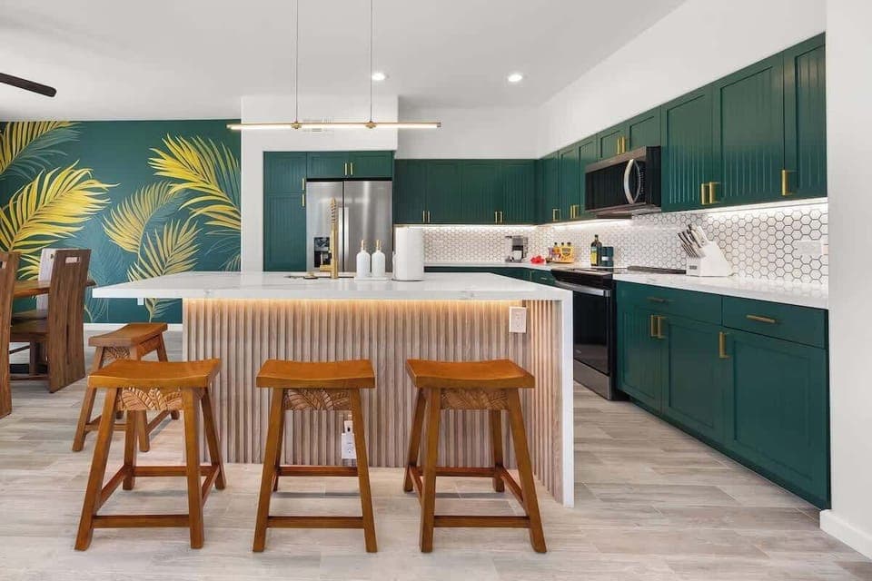 Modern chef’s kitchen with premium new appliances and tropical touches 