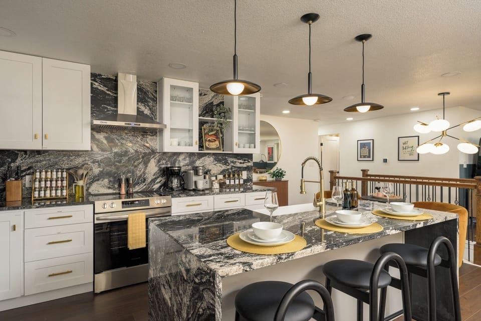 Cook, entertain, and gather in this modern chef’s kitchen featuring upscale finishes, full cookware, and thoughtful design.
