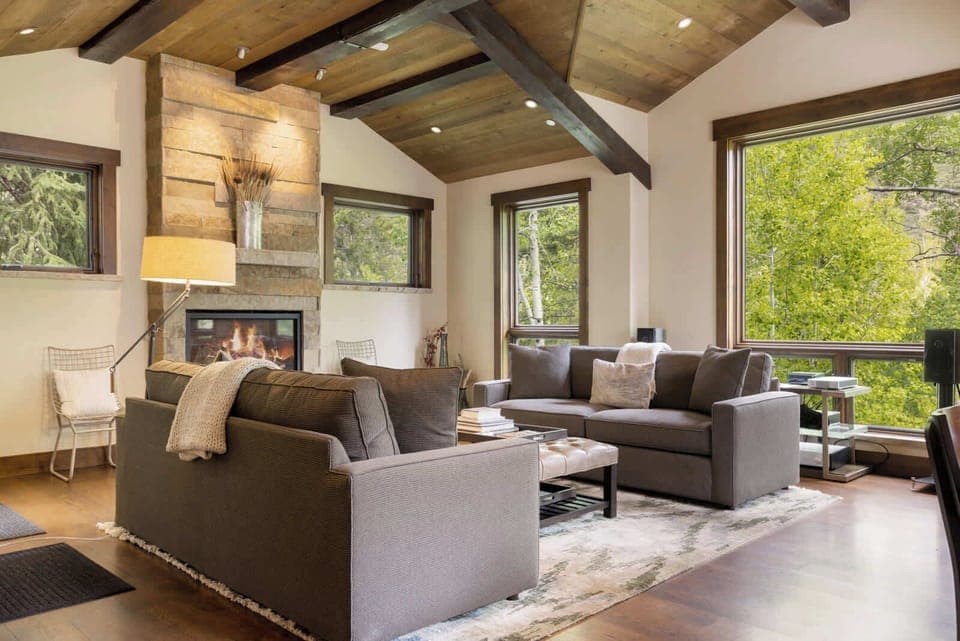 Curl up with a glass of wine by the fireplace in the inviting living room