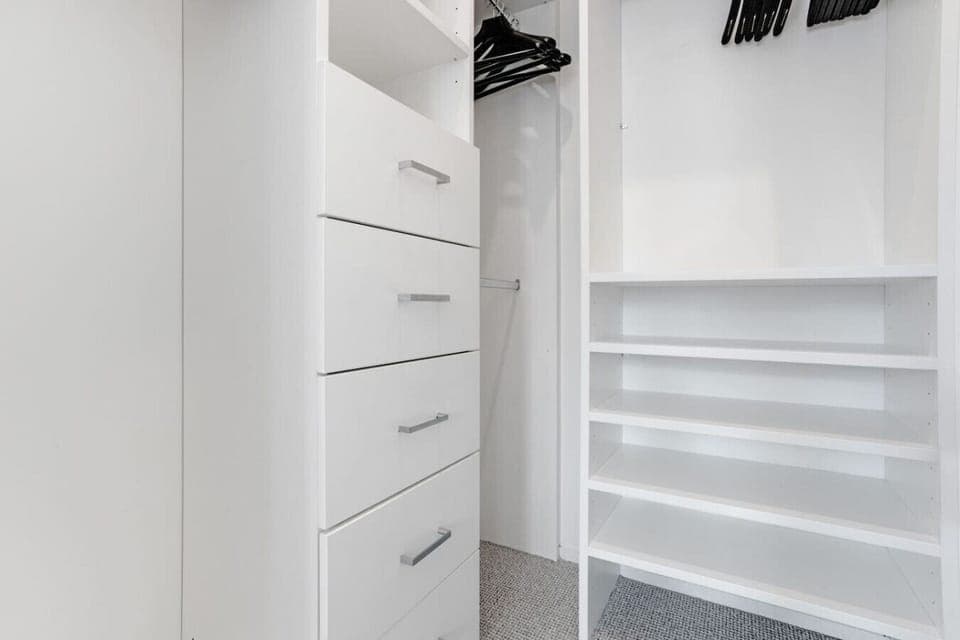 There is plenty of storage in the walk-in wardrobe for all your personal belongings.