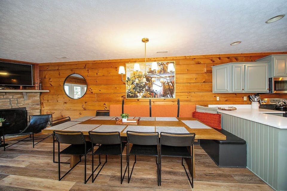 The dining table seats 12 with bench and standard seats.