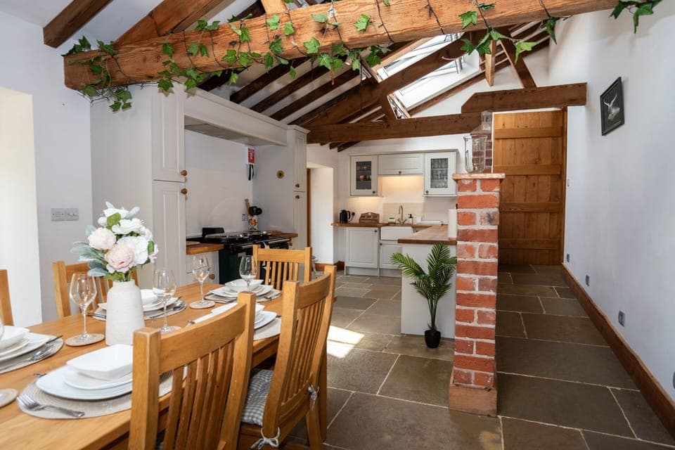 Elegant open-plan kitchen with seating for 8 and all crockery, cookware and glassware provided — ideal for hosting and special meals