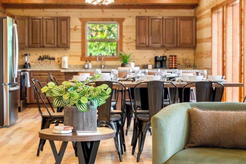 Main living area with plenty of seating, fireplace, and large TV.