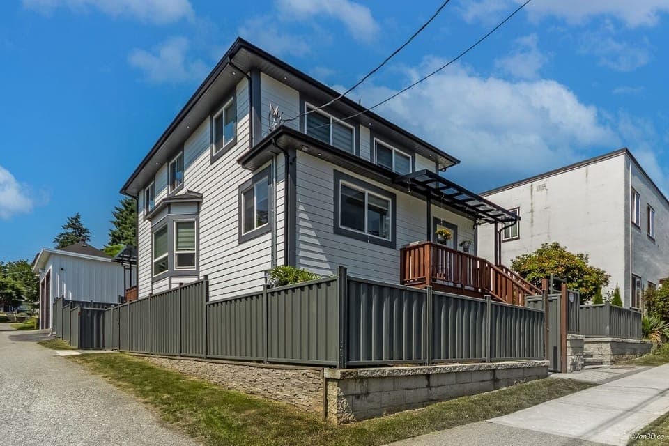 Corner house with a side alley.