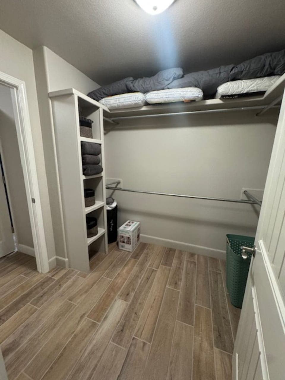 Large master closet where you'll find extra linens, pack n play & booster seat