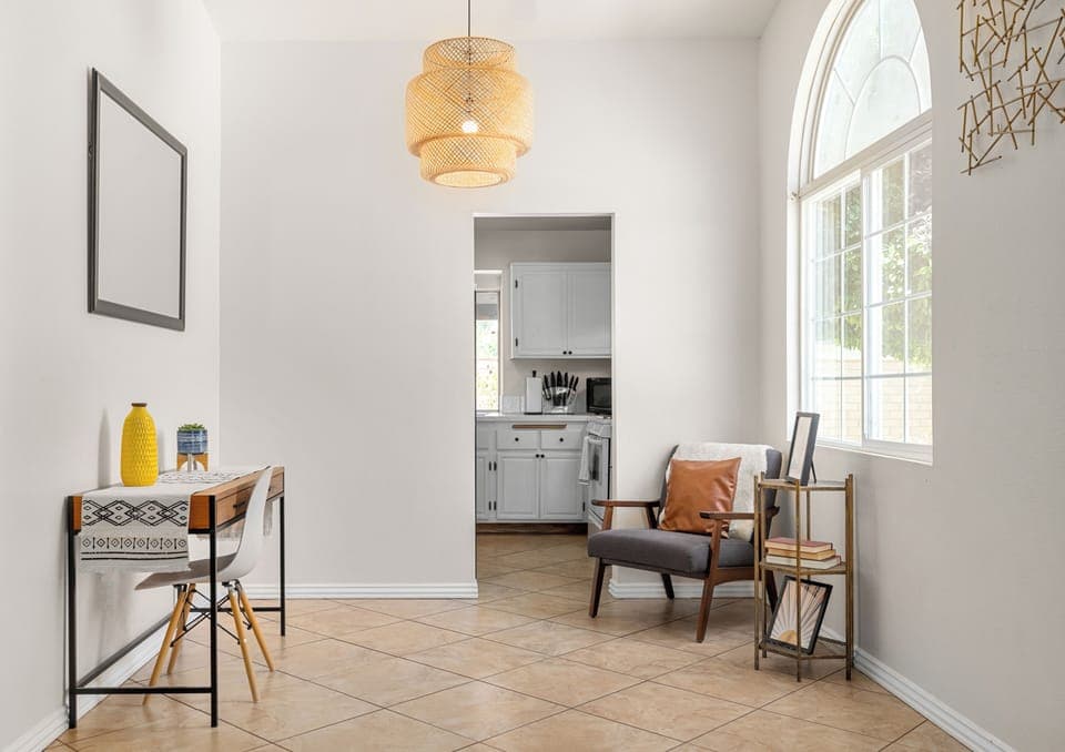 Natural light fills this stylish living space, creating welcoming atmosphere