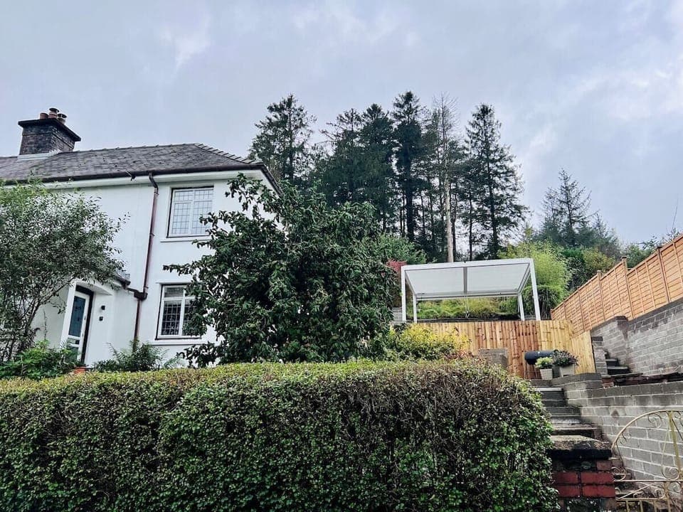 Taf Fechan exterior, with two tier garden and pergola.