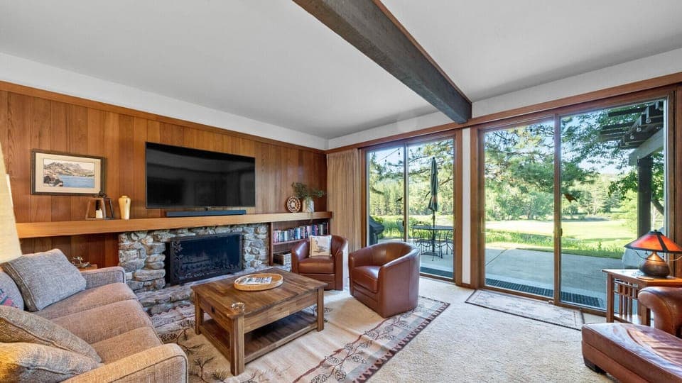 Enjoy sweeping views of Graeagle Meadows Golf Course from the living room