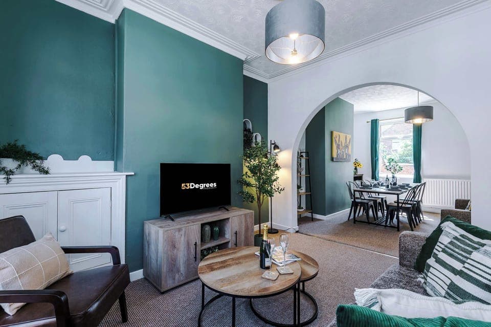 The living room is a light and open space, perfect for relaxing after a long day. There is a sofa bed, comfy seating, SMART TV with Netflix and an open plan dining room to enjoy.