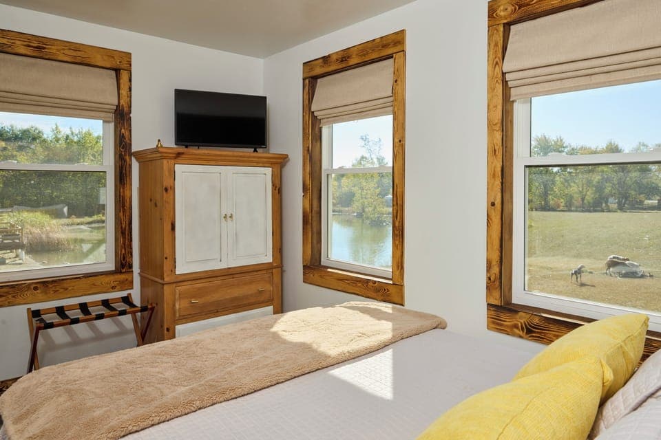 View of property, pond and animals from bedroom