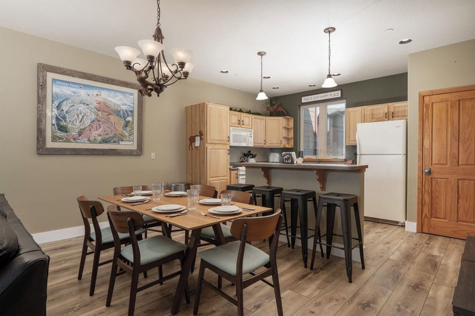 Gather around your spacious dining table for memorable meals, with a fully equipped kitchen and breakfast bar perfect for morning coffee chats.