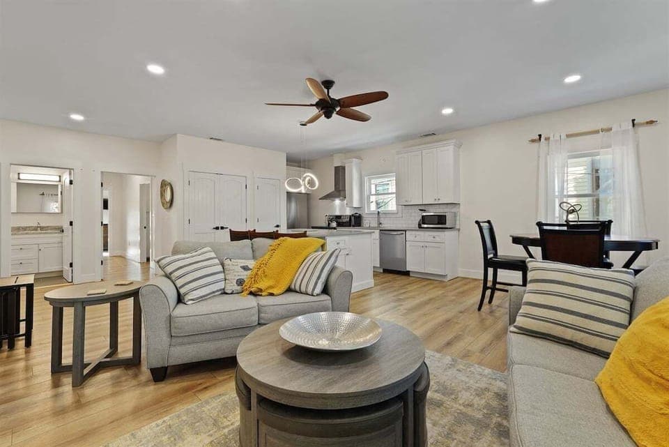 Cozy up in the inviting living room featuring a plush sofa, loveseat, and smart TV.