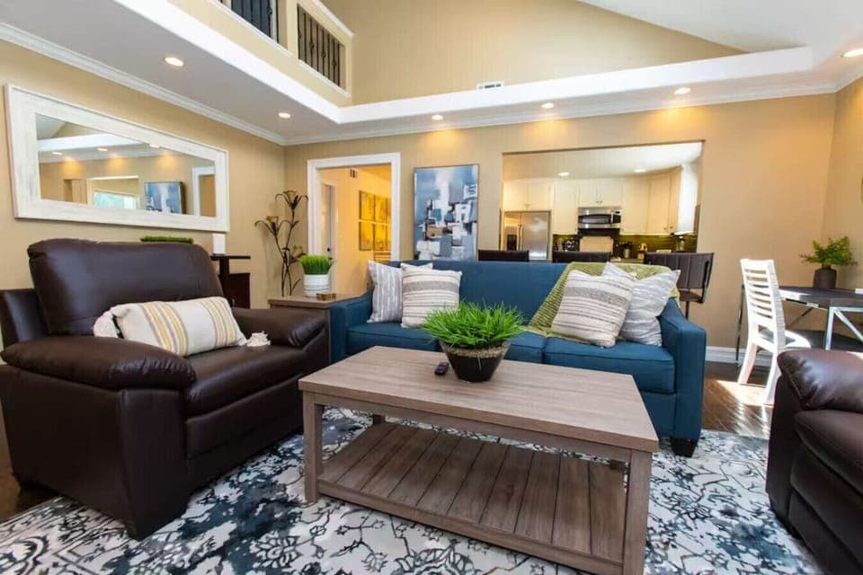 Relax and recharge in our cozy living room, featuring comfortable couch seating.