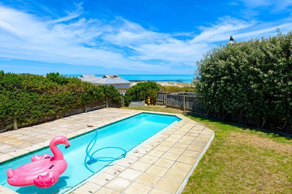 Pool, garden with trampoline leads directly onto the beach