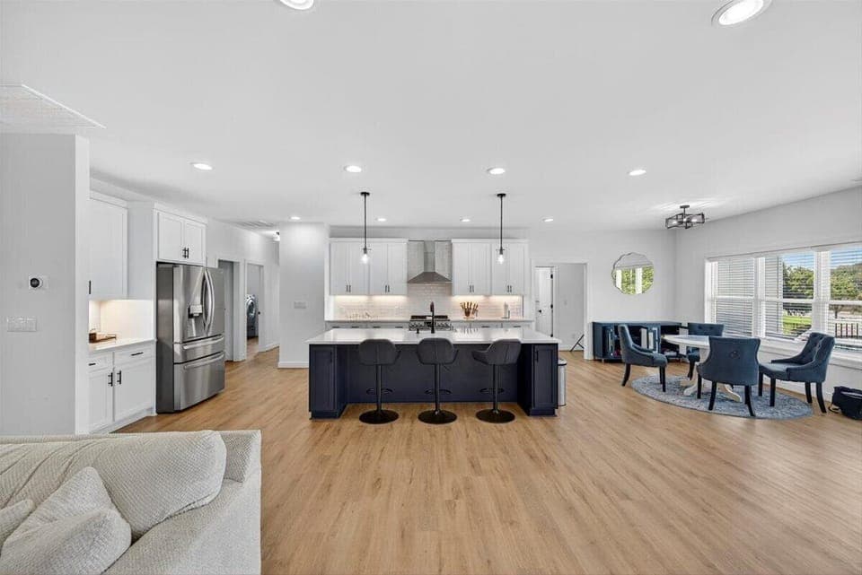 Fully stocked and ready to serve—cook with lake views in this open-concept kitchen.