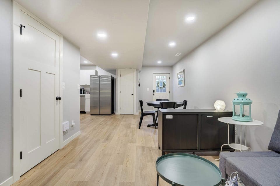 The open-concept layout offers a seamless flow from the living area to the kitchen and dining space, making it easy to gather, dine, and unwind together in comfort.







