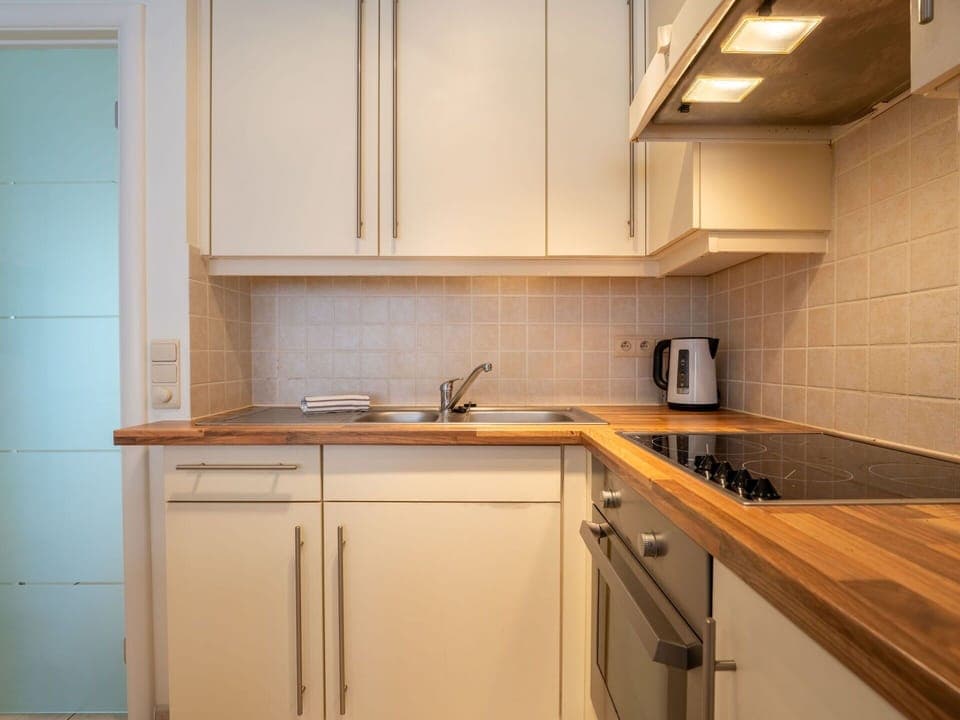 Countertop, Kitchen Appliance, Kitchen, Cabinetry, Major Appliance, Flooring, Interior Design, Wood, Plumbing Fixture, Furniture