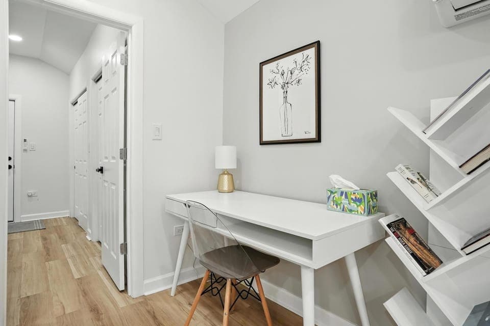 Work Space A bright and peaceful nook with a modern desk, sleek chair, and ambient lighting—ideal for remote work, study sessions, or journaling. Complete with a nearby bookshelf and thoughtful decor to keep you inspired during your stay.