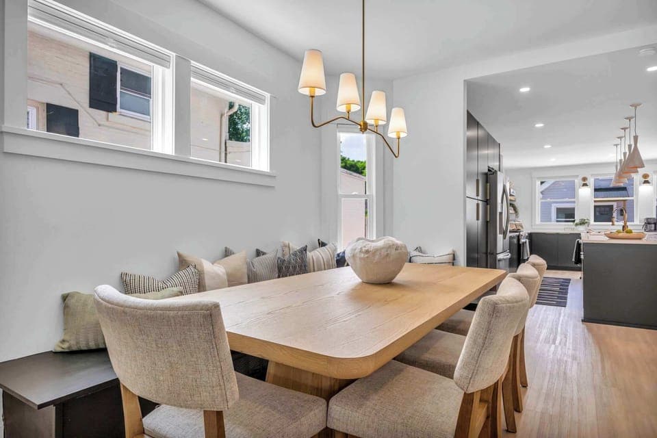 Bask in natural light pouring through oversized windows as you dine or relax. This bright, stylish space is perfect for cozy breakfasts, lively dinners, and everything in between.
