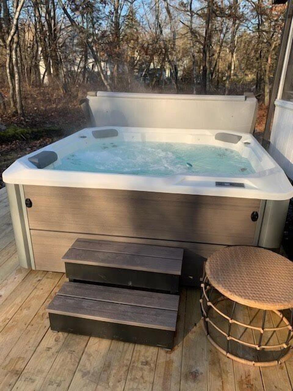 A beautiful hot tub only a few years old with waterfall feature.