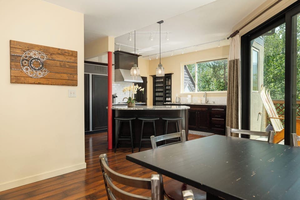 Your modern kitchen and dining space flows seamlessly together, with granite countertops and sleek bar seating perfect for morning coffee.