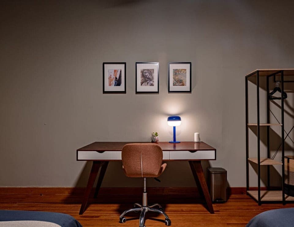 Functional workspace with a sleek desk and a comfortable chair.