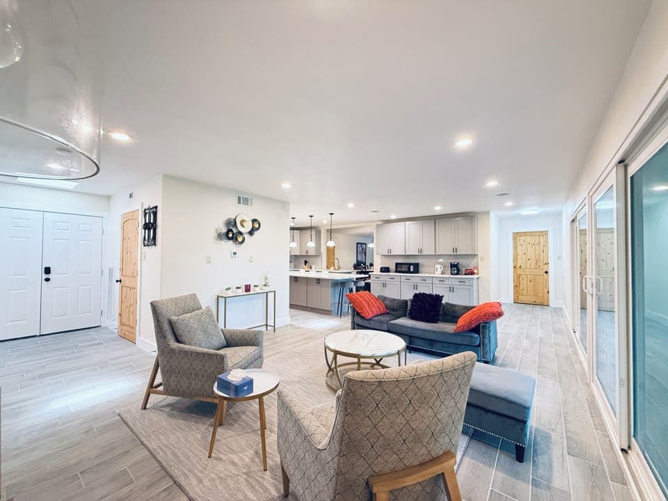 Family room open to the kitchen and beautiful water view of the back yard